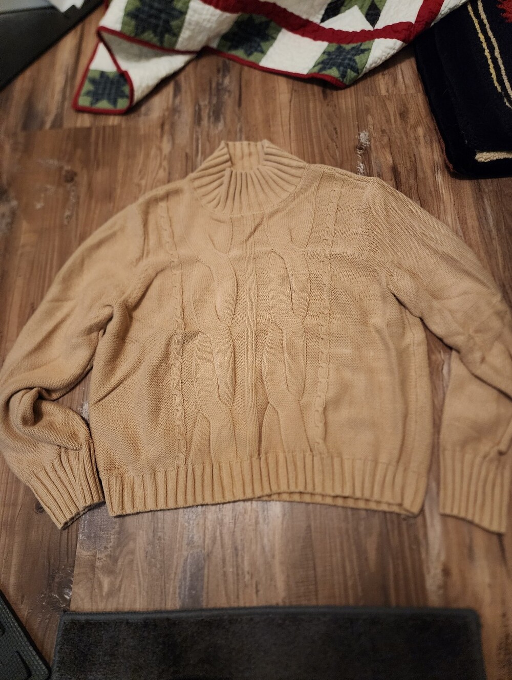 Calvin Klein tan cable knit roll neck sweater.